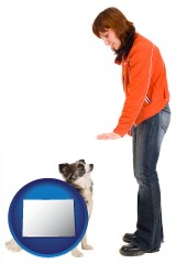 colorado map icon and a woman training a pet dog