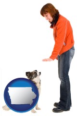iowa map icon and a woman training a pet dog