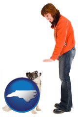 north-carolina map icon and a woman training a pet dog