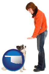 oklahoma map icon and a woman training a pet dog