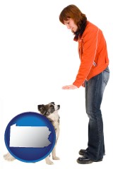 pennsylvania map icon and a woman training a pet dog