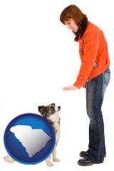 south-carolina map icon and a woman training a pet dog