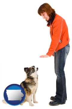 a woman training a pet dog - with Iowa icon